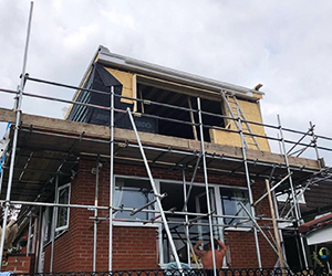 Construction team working on a loft conversion build
